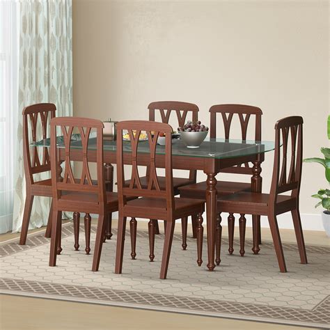 Regal furniture - Item name: Wooden Dining Table | TDH-301-3-1-20 (Stella) Item code: 99215. Brand: Regal Furniture. Material : Wood. Dimension : 152 X 91 X 77 CM (Length X Width X Height) Seating Capacity : 6. Top Material : Glass. Table Shape : Rectangle. The Dining Table Top is made of durable tempered glass that lasts …